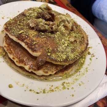 Brookline Lunch signature dishes Baklava Pancakes, Falafel, Hummus, The Zaki (shakshuka)